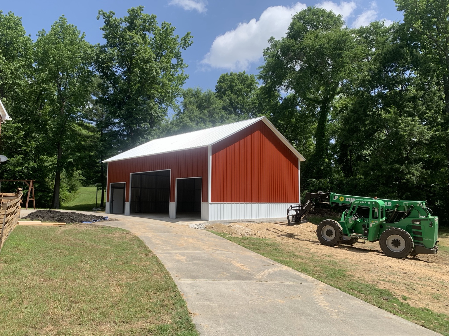 Red building with white trim and multiple openings