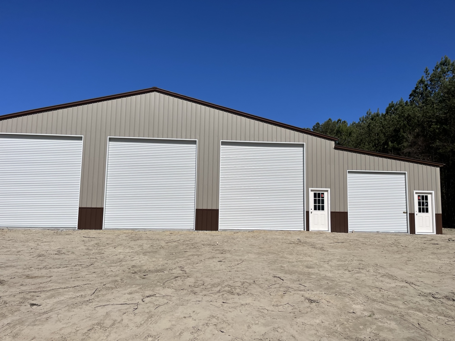 Large multi-door building with an enclosed side addition